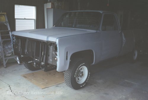 Another photo of the truck in primer with the hood back on